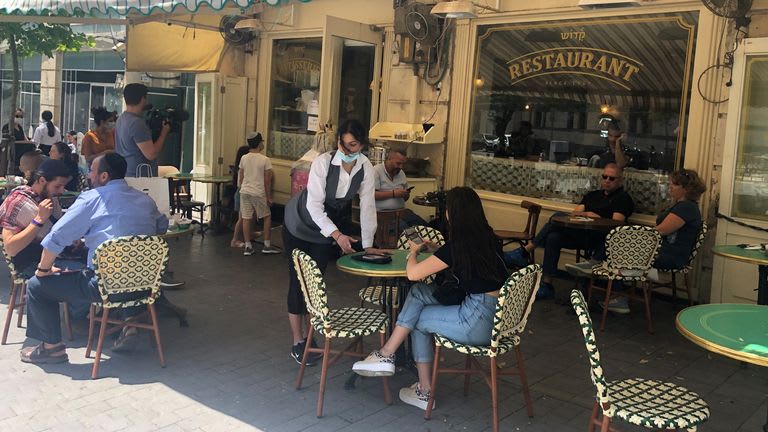 Coronavirus: Restaurants and cafes reopen in Israel under strict rules