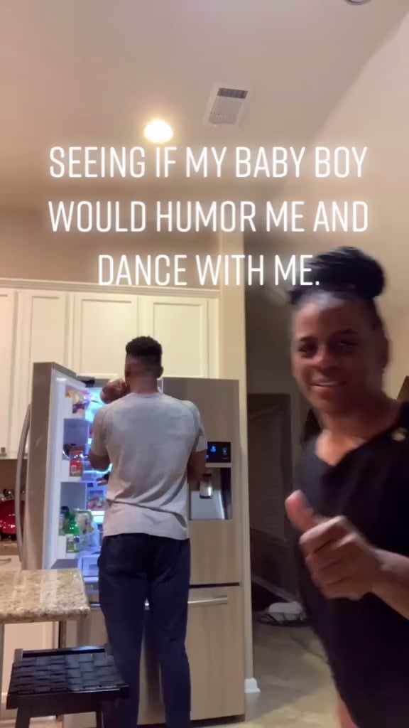 Son Came Home From College And Mom Is Seeing If He'll Humor Her With A Dance