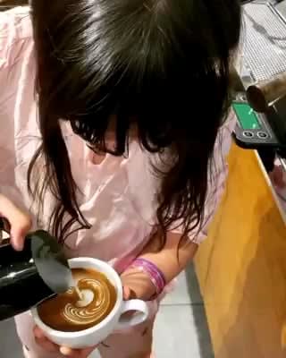 9 Year old kid is proud of her coffee art