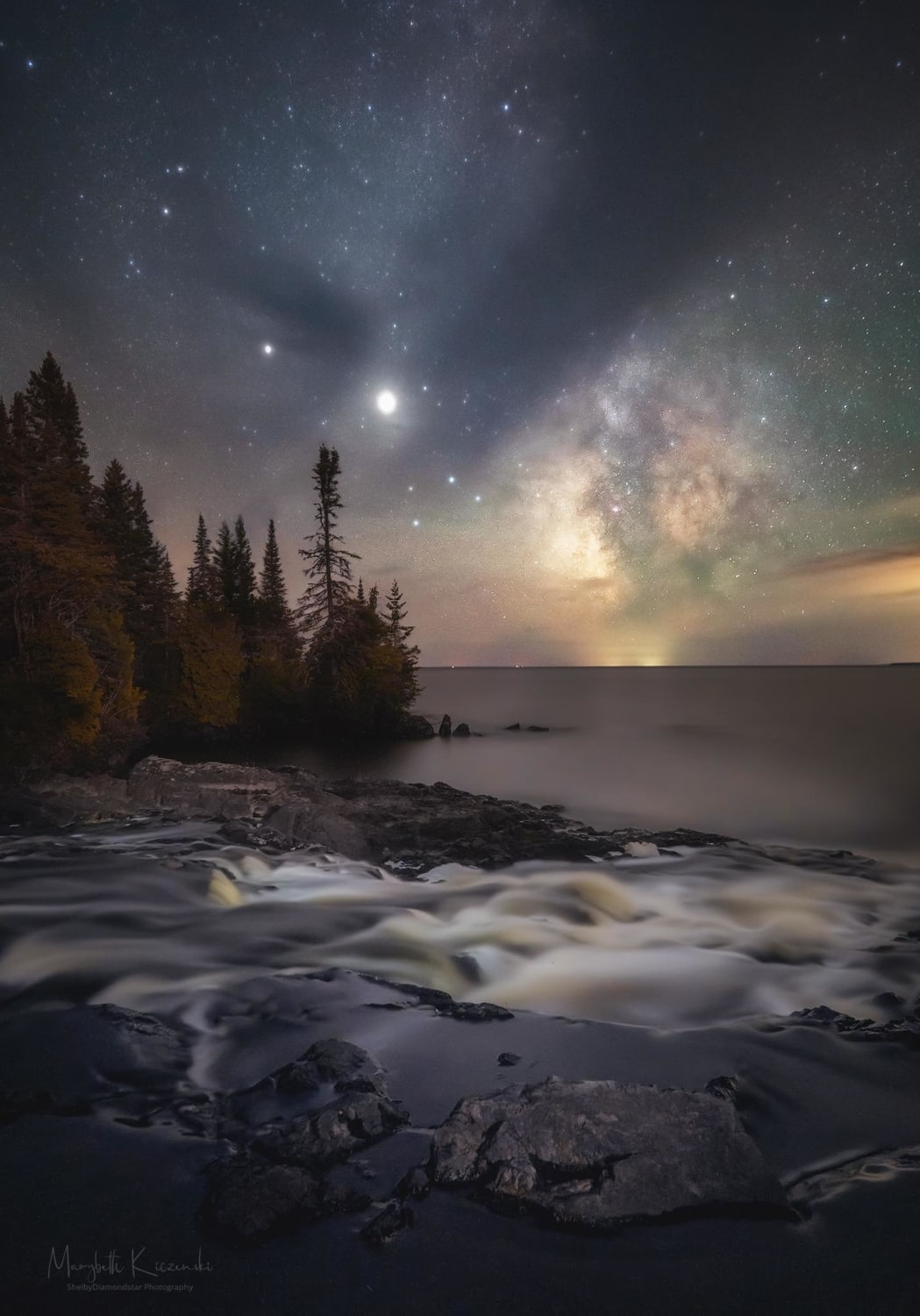 Milky Way and clouds creating a dreamy view of this waterfall at the edge of Lake Superior - Northern Michigan, USA.