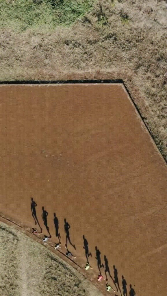 Runners casting shadows