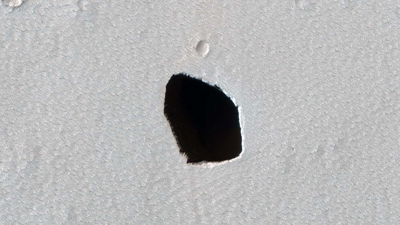 NASA stares into dark, freaky pit on Mars