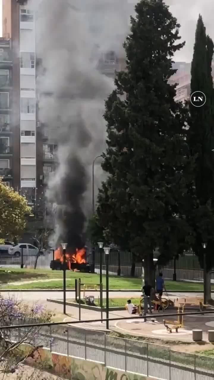 Taxicab catches fire and goes down the street, driverless - then it hits two parked cars and explodes. The driver got out and ran to safety, with no other victims being reported at the time. Buenos Aires, Argentina, oct-25-2021