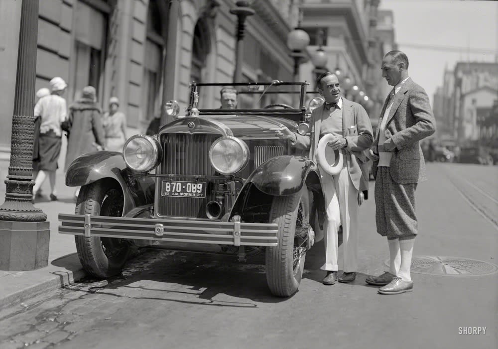 Al Jolson and Cadillac touring car at St. Francis Hotel, San Francisco, 1927.