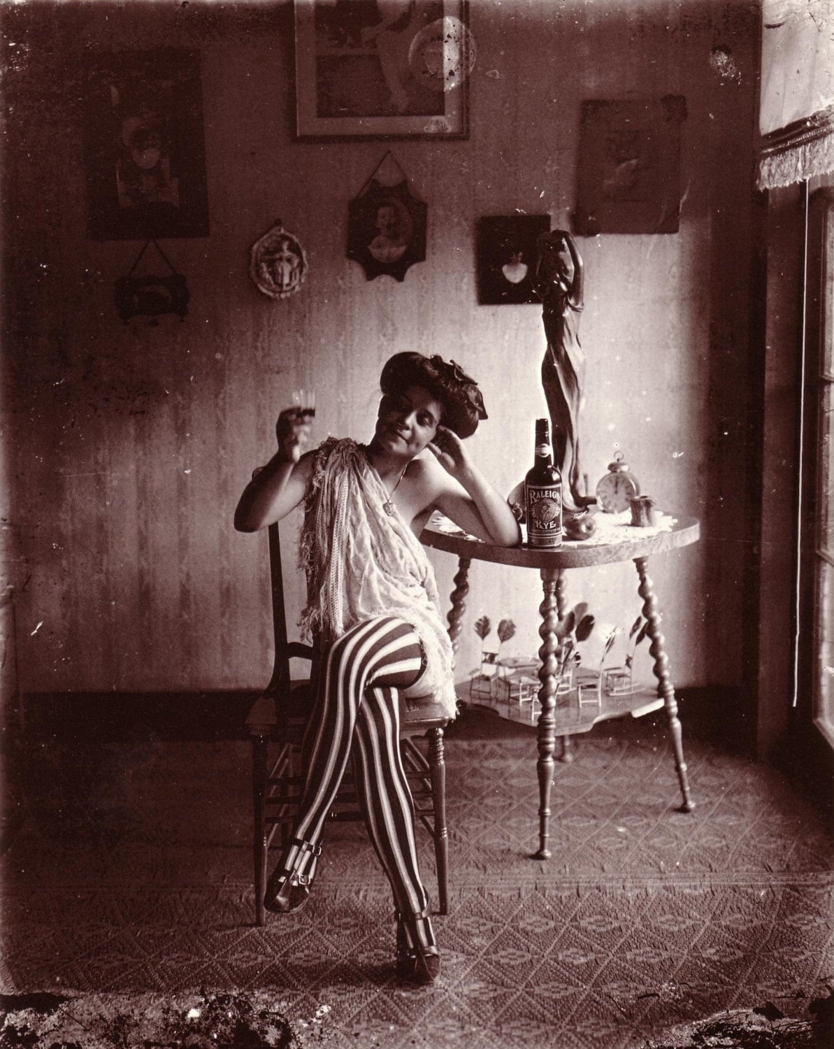 Prostitute at a Storyville, New Orleans brothel in 1912, the only legalized red-light district in North America until it was shut down in 1917.