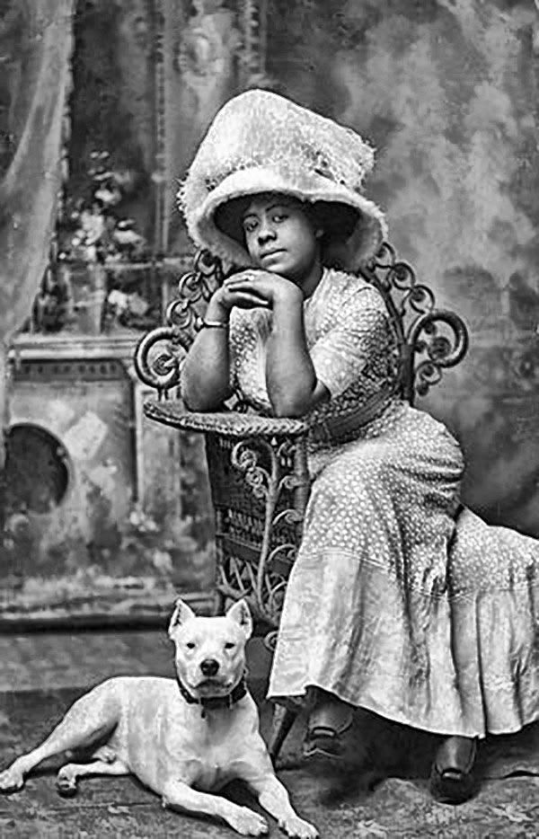 Portrait of a woman with her dog c. 1910
