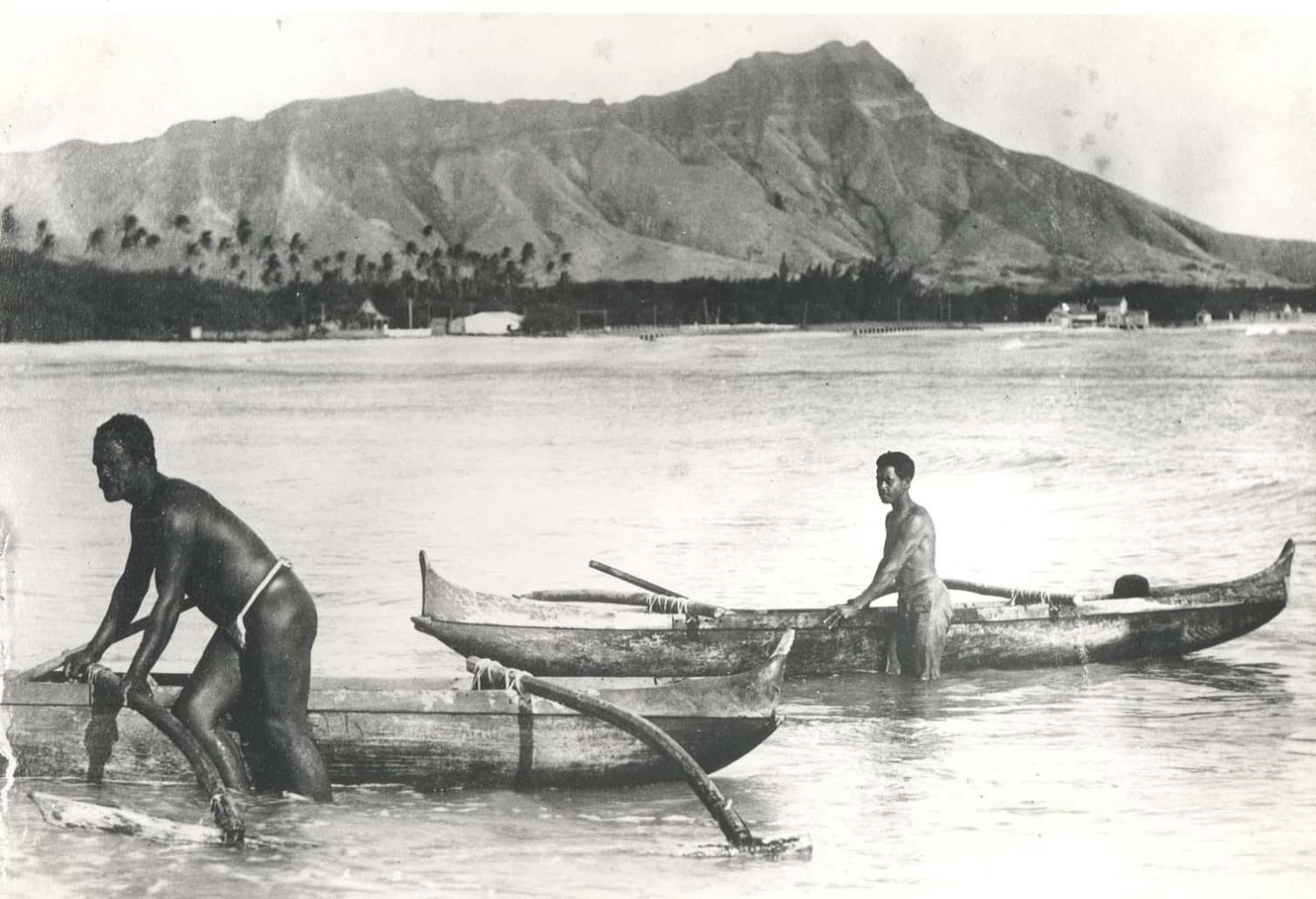 Natives of Hawaii on the beach of Waikiki after a morning of fishing in 1895.