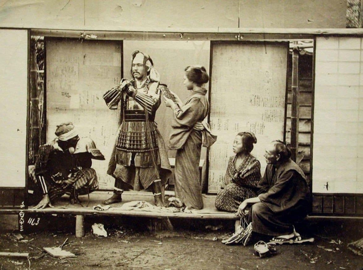 A samurai warrior equipping his armor, Japan (circa 1860s-1870s)