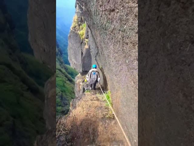 Mountaineer Walks Down Steep Path With Help of Rope at Bhairavgarh Fort in Maharashtra - 1211009