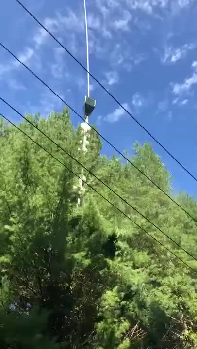 A chainsaw from hell swinging by some power lines
