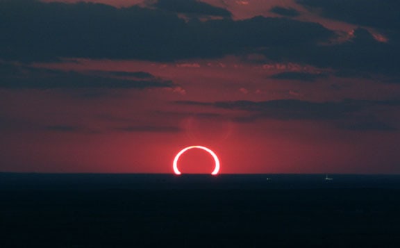 A beautiful view of Sunset and a Solar Eclipse all happening at the same time