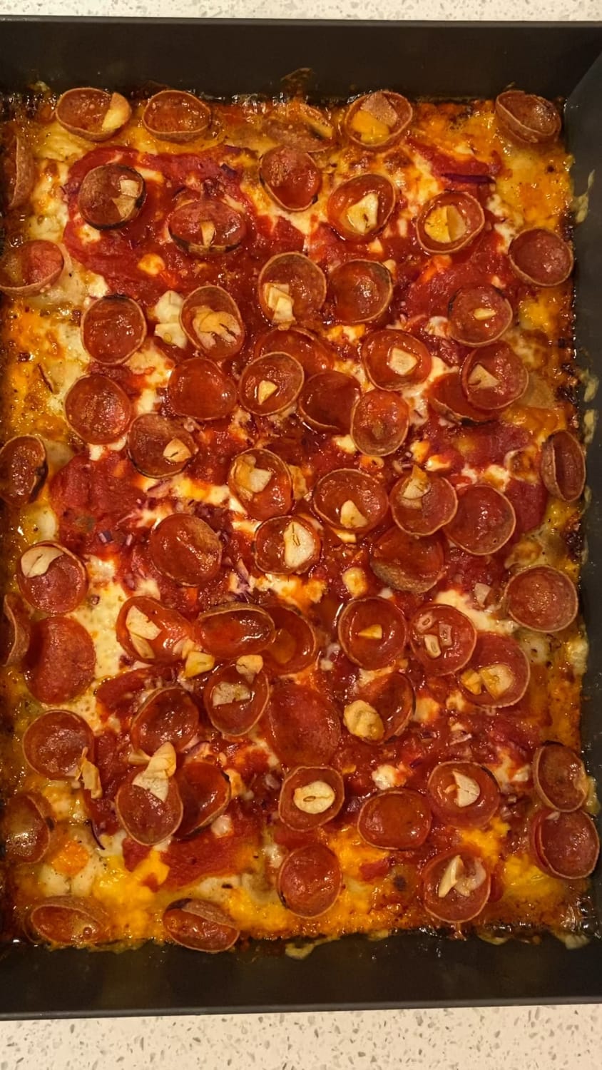 Love that sizzle when it comes out of the oven - Detroit pizza with pepperoni, garlic, and red onion