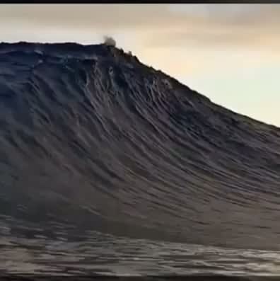 Massive Wave Brushes the Clouds