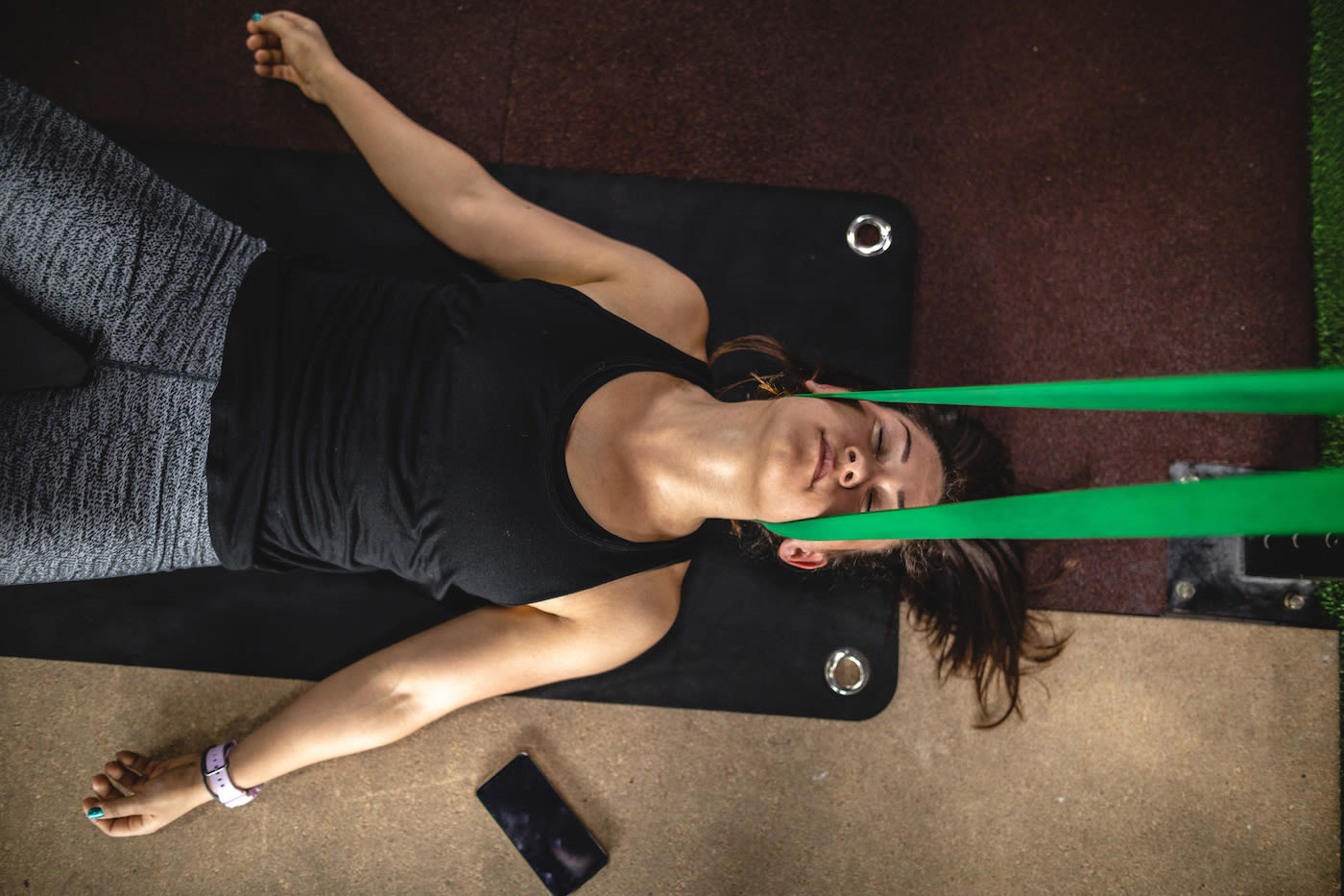 All you need is a towel and a resistance band for this 5-minute neck decompression stretch