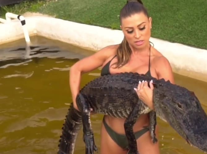 Playboy Model Criticised For Squatting An Alligator In 'Cruel' Workout Video