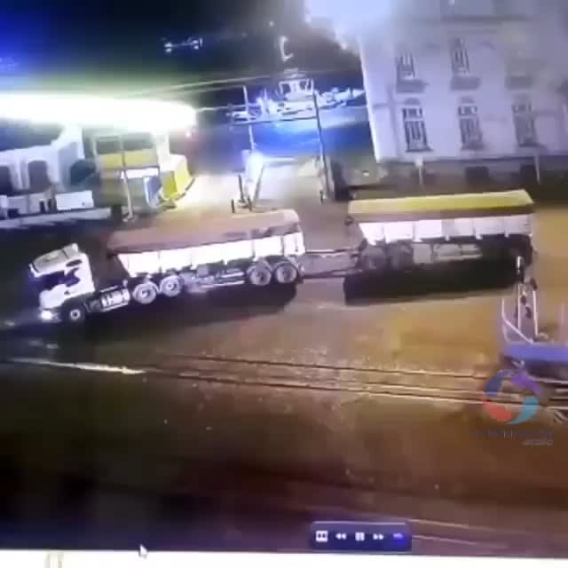 Does "idiots in semis" counts? It happened yesterday in my hometown (Santos, Brazil). Semi driver ignored the train warning and lights and thought he could manage to cross the railway. At the end of the video, photos of the aftermath.