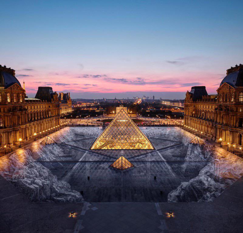 In honor of the 30th anniversary of the Louvre Pyramid in Paris, the museum commissioned an art installation envisioned by award-winning French street artist Jean Rene. It took 400 volunteers four days to make his vision come to life.