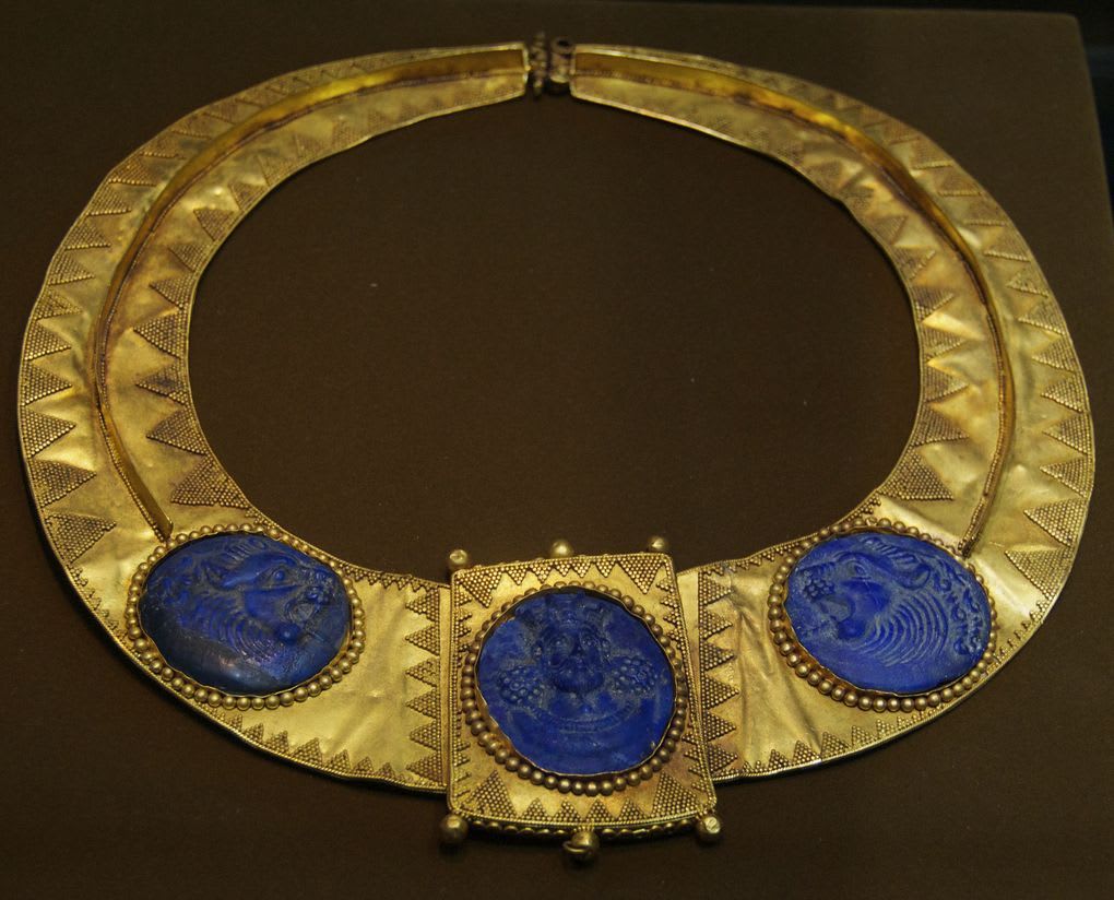 A Gold Persian necklace/pectoral, with a king and flanking lions carved in lapis lazuli. Sasanian period, 5th - 6th century A.D.