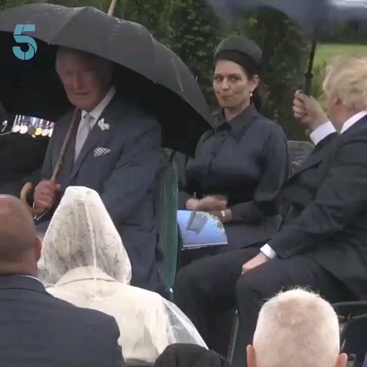 ...To put up an umbrella by UK PM, Boris Johnson