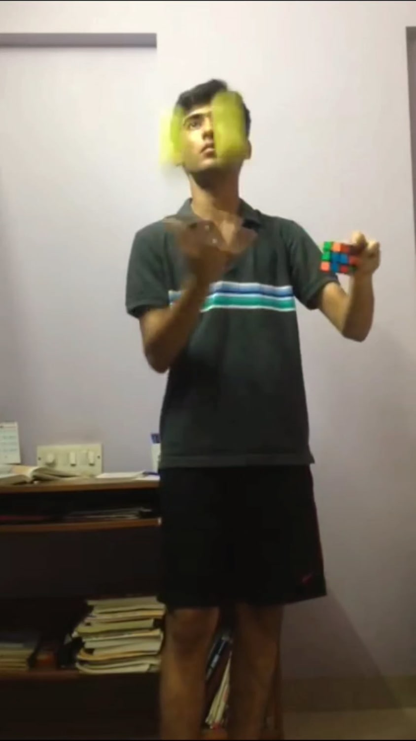 Myself solving a Rubik's Cube while juggling two balls simultaneously :)