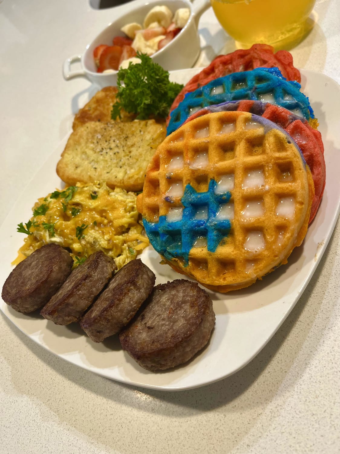 [Pro/Chef] honey butter waffles , eggs , sausage, and hash browns .