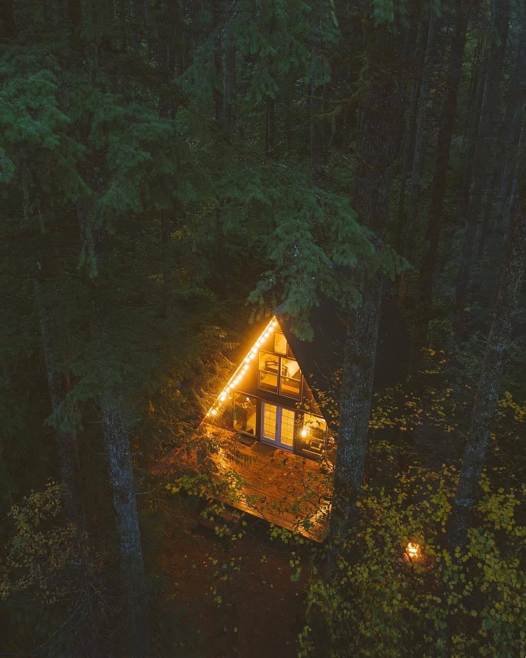 A-frame lit up in the woods of Washington State