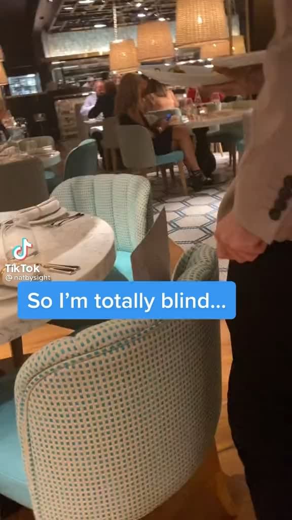 Restaurant staff wishes a blind woman happy birthday
