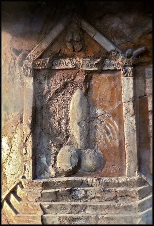 Stone phallus altar in Pompeii (note the white paint running down...) thought to protect the people with the power of the God Fascinus.