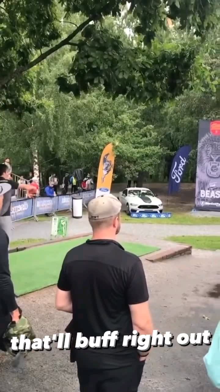 Pro disc golfer Elias Gripler hitting the mando and a car