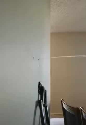 WCGW drilling a hole on the wall to mount a TV
