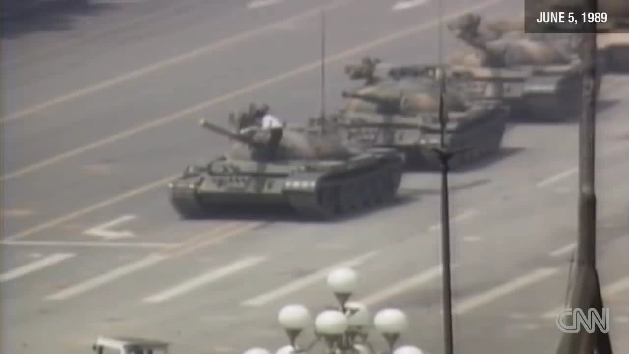 On June 5, 1989, an unidentified Chinese guy stood in front of a column of tanks leaving Tiananmen Square in Beijing, the day after the Chinese government's deadly crackdown on the Tiananmen protests. It is widely regarded as one of the most iconic photographs of all time. Here's the video: