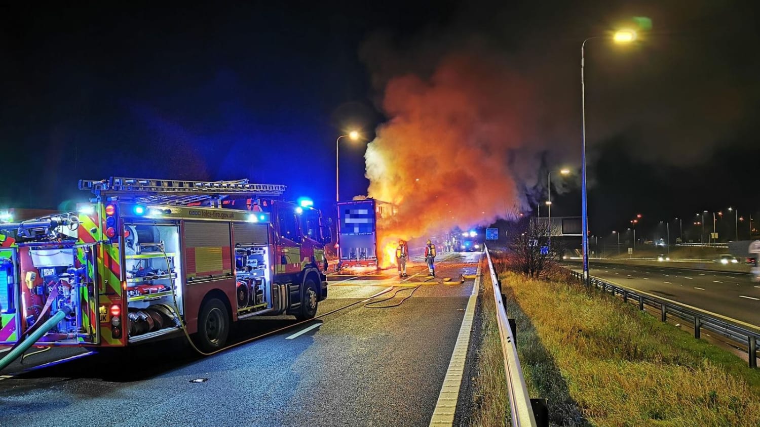 Burnt to a crisp: Lorry carrying Pringles catches fire on M1