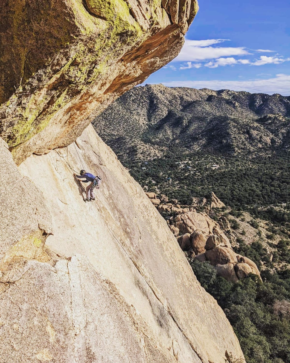 Cruxing out on The Beeline, East Cochise Stronghold, AZ. A d*** fine finger crack on slab.