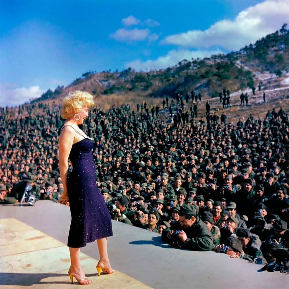 Marilyn Monroe singing to an audience of G.I.’s during the first show of her recent four-day tour of Korea on February 22, 1954