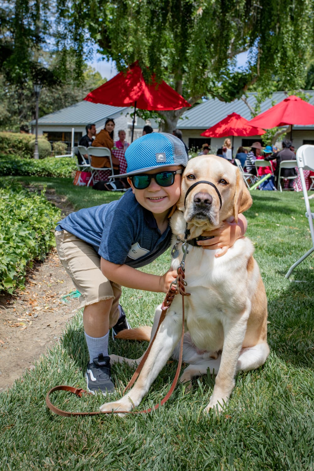 CJ & K9 Buddy, Benton. Benton was in training to become a guide dog but decided that he was a better fit to be CJ's bff. K9 Buddies are matched to children & young adults who are blind or visually impaired. A dog can contribute to heightened sensory development and greater self-esteem.