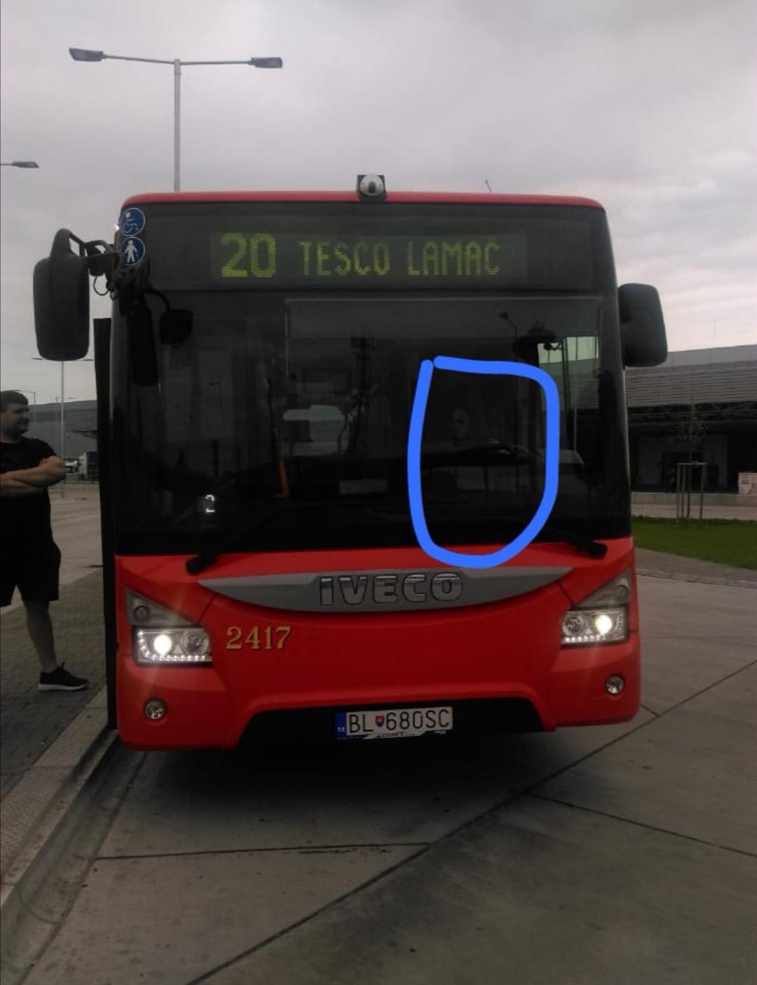 I took this photo last year when I was visiting my dad in work..he is a bus driver. As U can see there is a guy standing outside and next to him in bus is my father. I took a pic of the bus casually and when I looked at the pic I saw this...I don't know what to think, there were no one else with us.