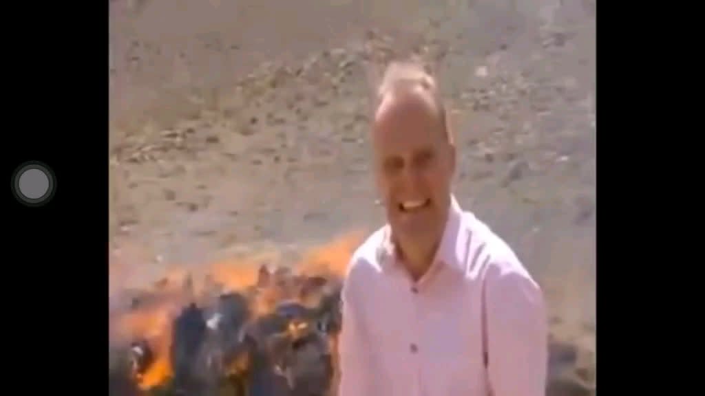 WCGW reporting near a pile of burning drugs