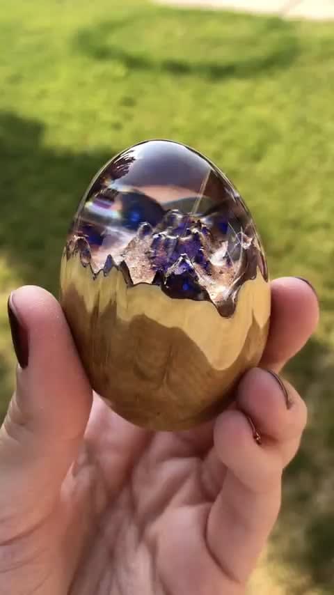 Gorgeous resin egg looks like a mini trapped world