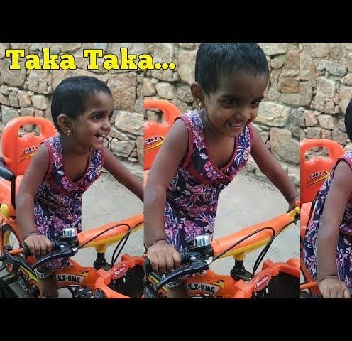 Baby Enjoying her BiCycle by laughing incredibly.