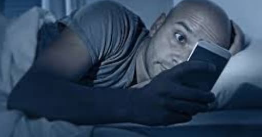Alarm for mobile phone users lying in bed