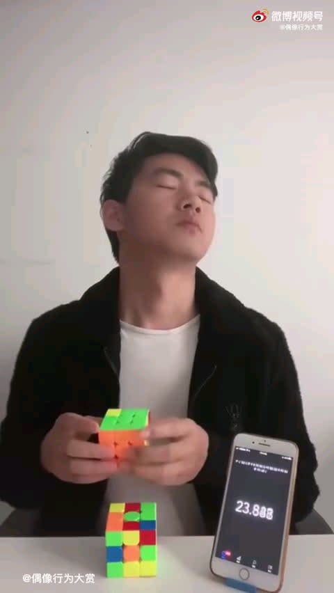 Man trying to solve a Rubik's Cube blindly, but in a different way