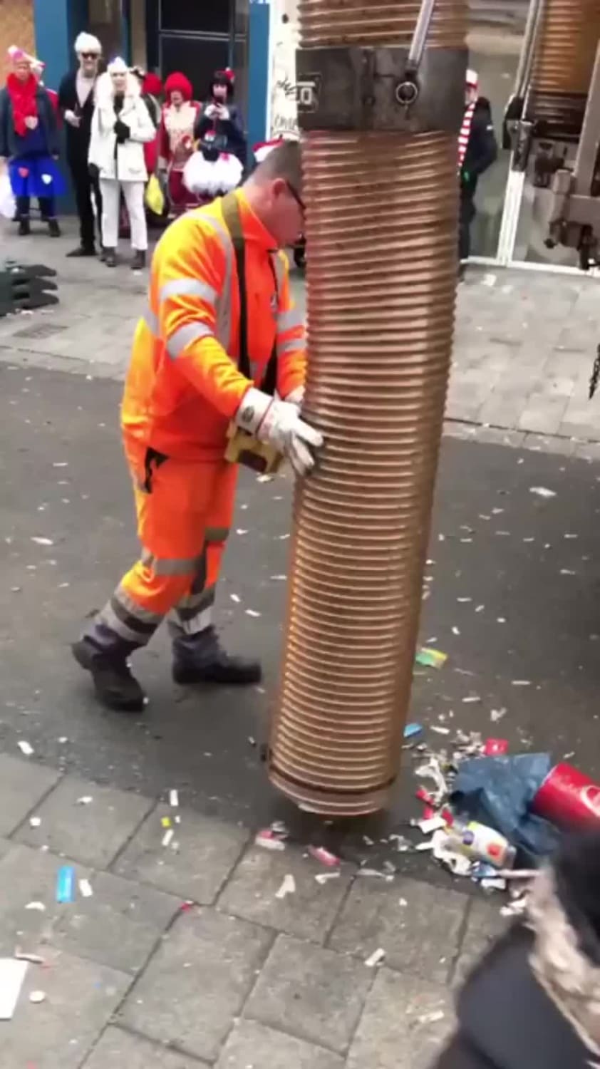 Huge street cleaning vacuum in action