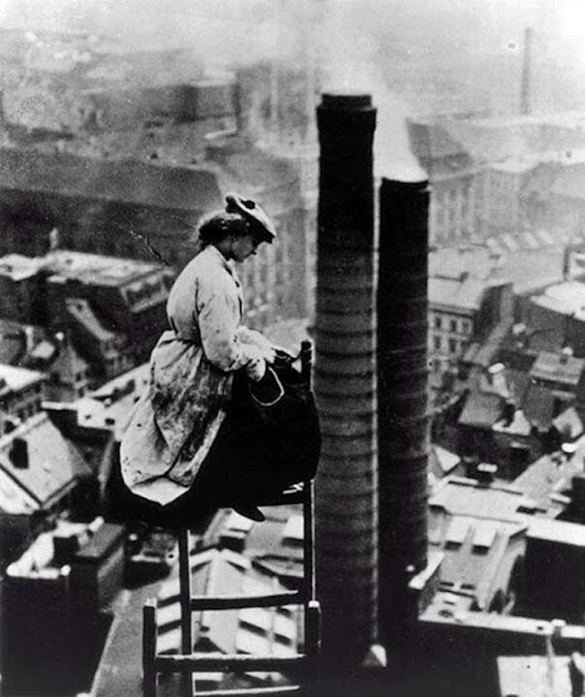 A female mason perched high above Berlin, ca. 1910.