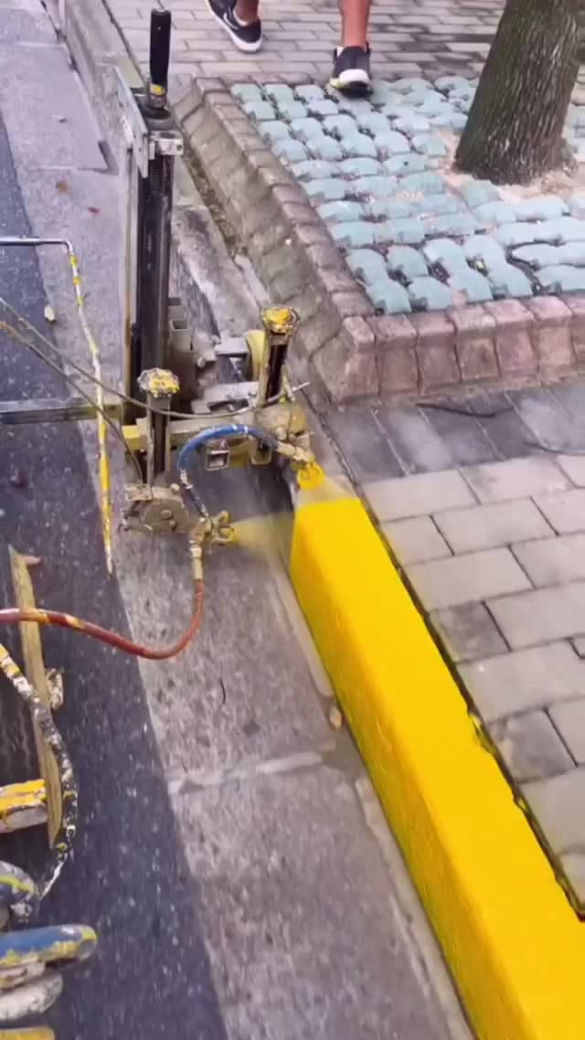 Applying paint to a curb