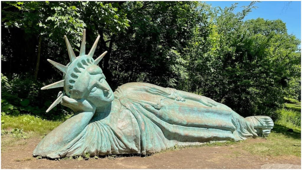 'Reclining Liberty', A Whimsical Reinterpretation of the Statue of Liberty Relaxing in a New York City Park