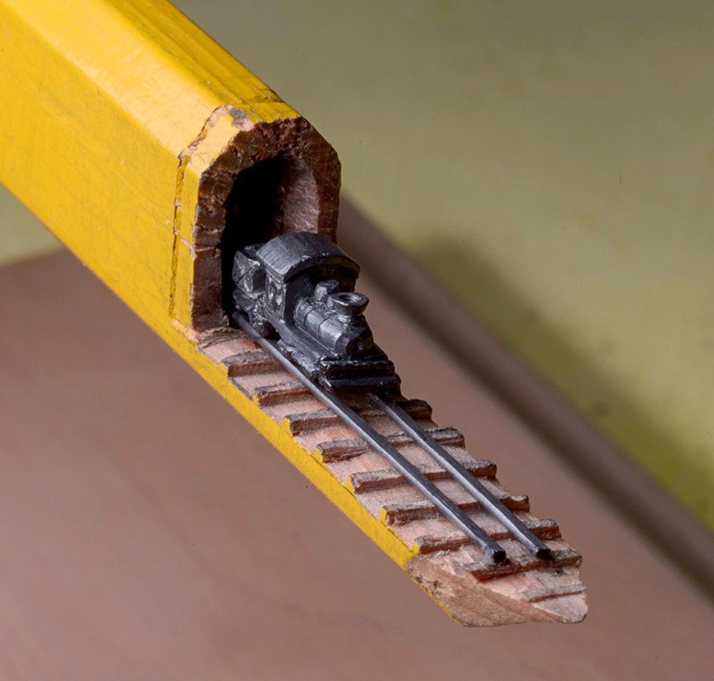 Train carved from a pencil