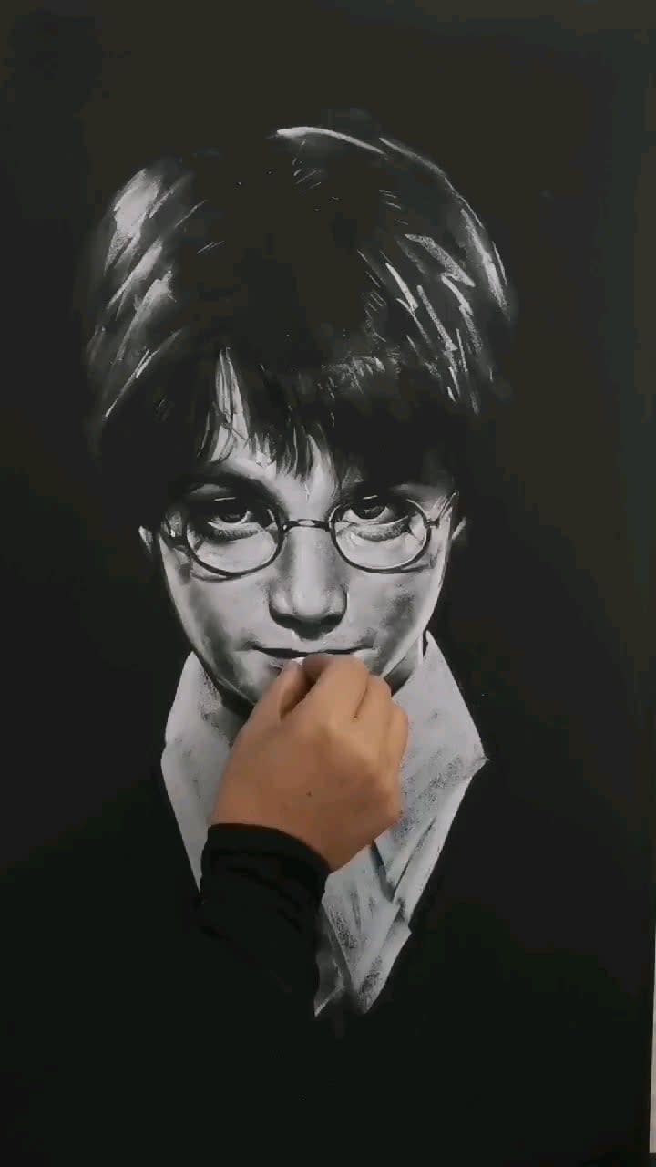 Drawing Harry Potter on a chalkboard