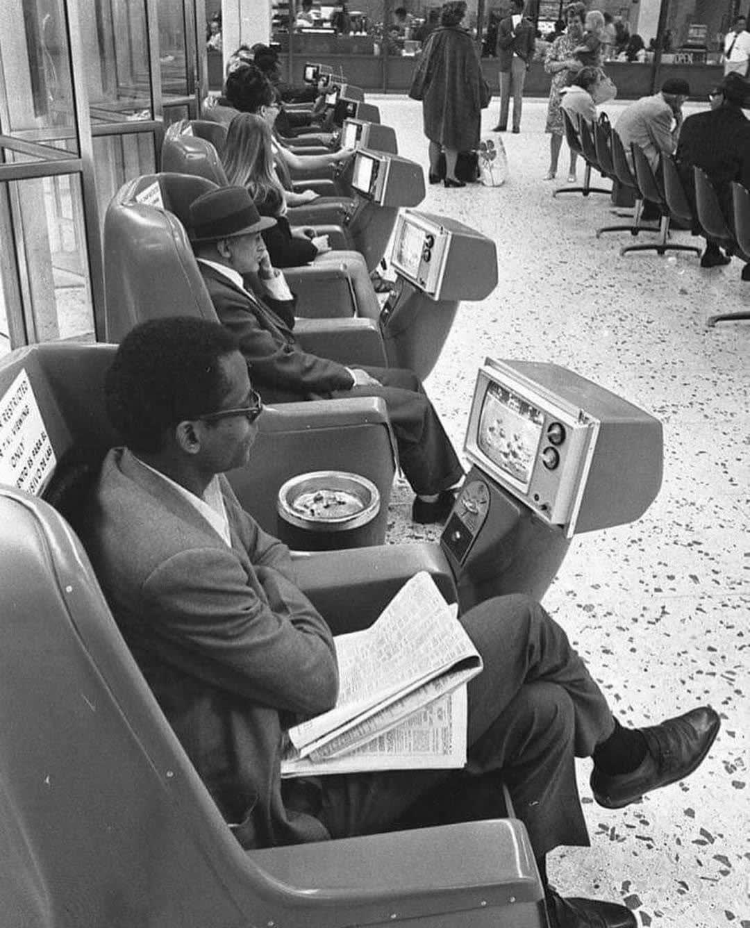 Coin-operated Tel-a-Chairs" in the Los Angeles Greyhound bus terminal. Ashtrays also included. 1969.