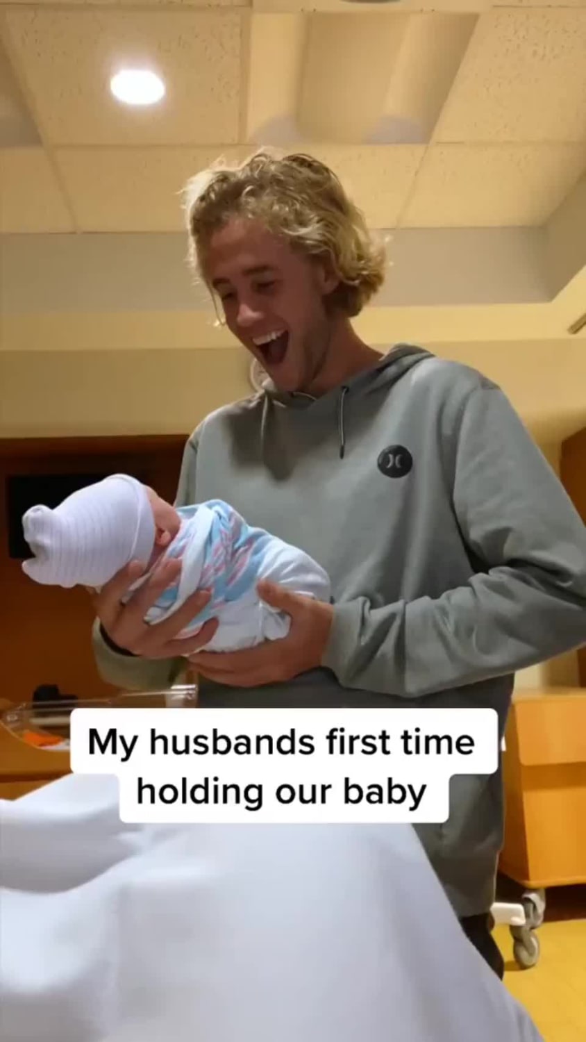 Dad hold son for first time