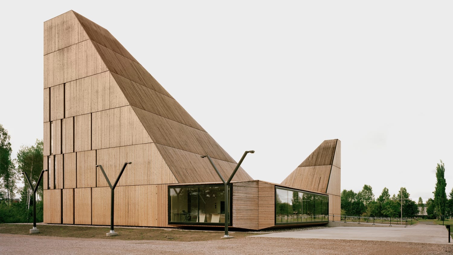 Angular roofs top timber church designed to evoke its lost predecessor